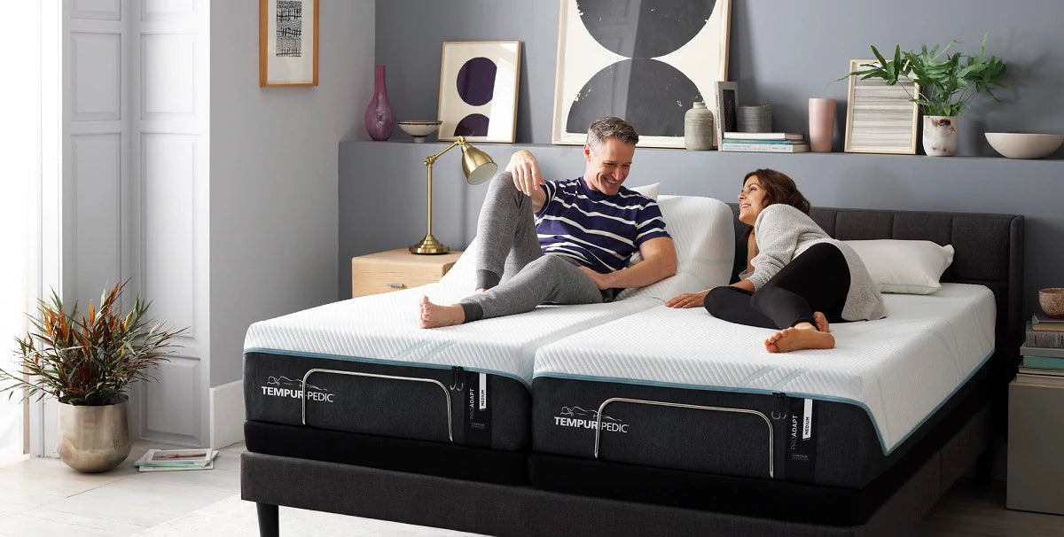 couple on tempur-pedic luxury bed in bedroom
